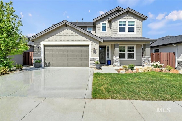 3303 S Island Fox Ave, Eagle, ID 83616 - craftsman-style home with an attached garage, concrete driveway, and stone siding