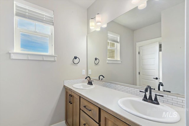 3303 S Island Fox Ave, Eagle, ID 83616 - bathroom with double vanity, plenty of natural light, and tasteful backsplash