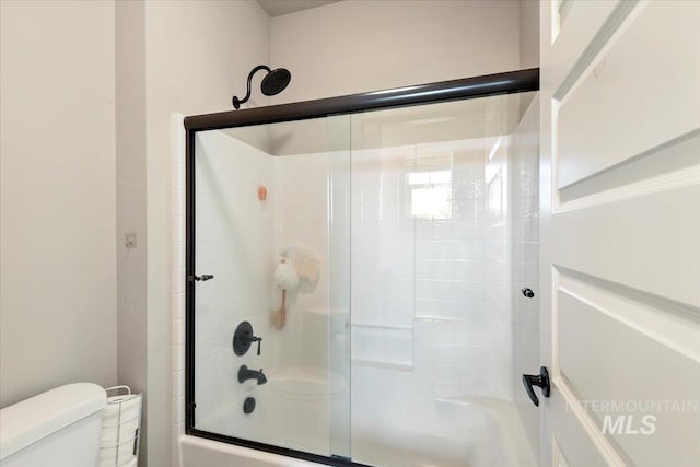 3303 S Island Fox Ave, Eagle, ID 83616 - full bathroom featuring toilet and combined bath / shower with glass door