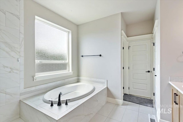 3303 S Island Fox Ave, Eagle, ID 83616 - full bath with a garden tub, vanity, tile patterned floors, and baseboards