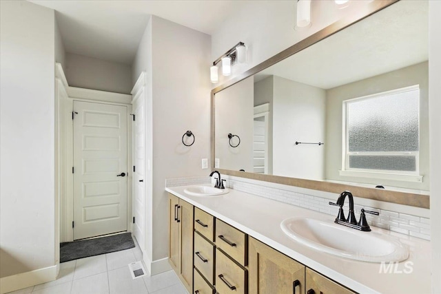 3303 S Island Fox Ave, Eagle, ID 83616 - full bathroom with double vanity, baseboards, tile patterned flooring, and decorative backsplash