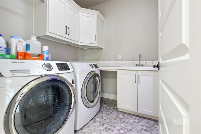 3303 S Island Fox Ave, Eagle, ID 83616 - laundry room featuring washer and clothes dryer and cabinet space