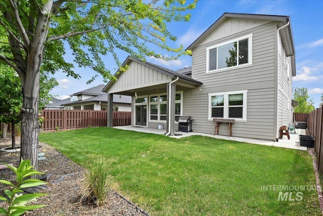 3303 S Island Fox Ave, Eagle, ID 83616 - rear view of house featuring board and batten siding and a patio area