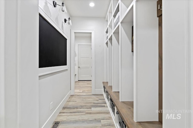 mudroom with light wood-type flooring