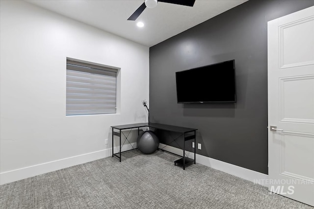 miscellaneous room featuring light carpet and ceiling fan