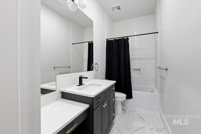 full bathroom with vanity, toilet, and shower / bath combo with shower curtain