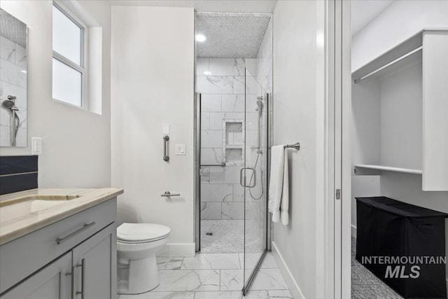 bathroom with vanity, toilet, and walk in shower