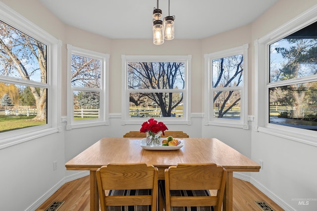 dining space featuring light wood-type flooring