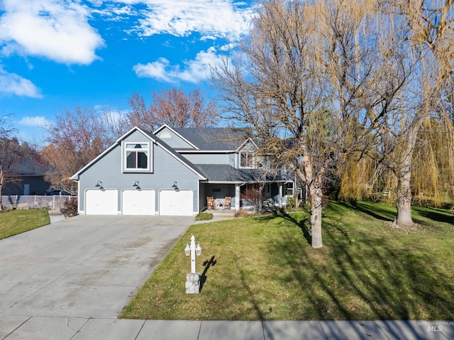 view of front facade with a garage and a front lawn