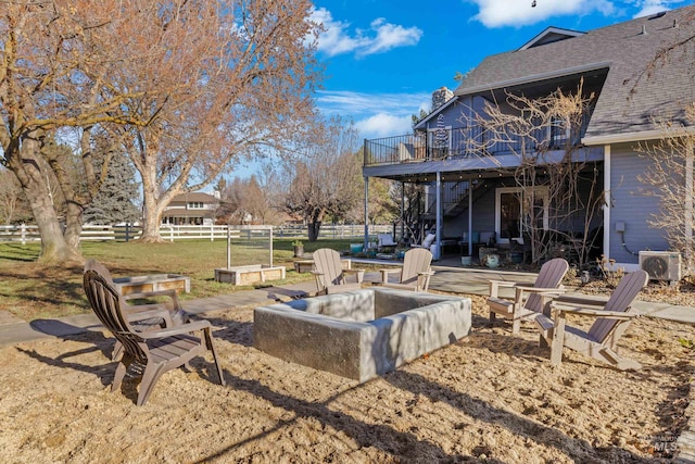 view of yard featuring a fire pit, ac unit, and a patio area