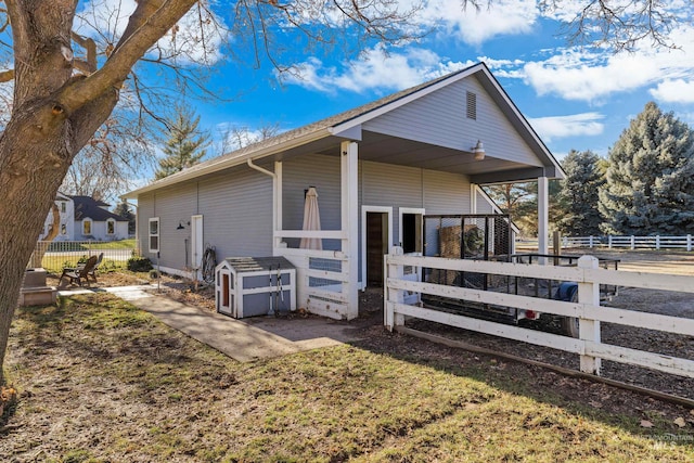 view of side of property featuring an outbuilding