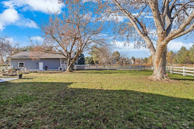 view of yard with a rural view