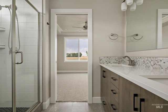 7017 S Zenith Ave, Meridian, ID 83642 - full bathroom with tasteful backsplash, a ceiling fan, a sink, a stall shower, and double vanity