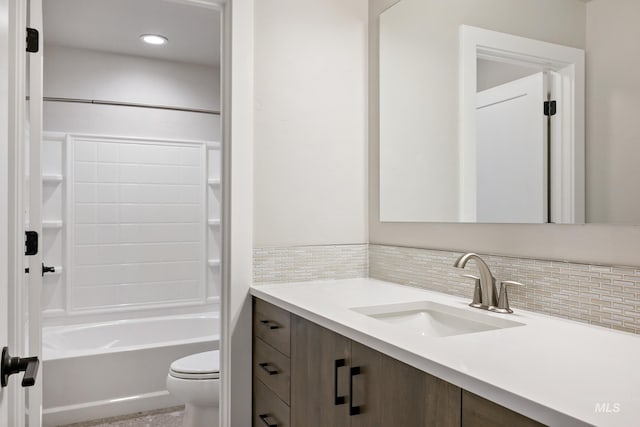 7017 S Zenith Ave, Meridian, ID 83642 - bathroom featuring toilet, vanity, decorative backsplash, and shower / bathtub combination