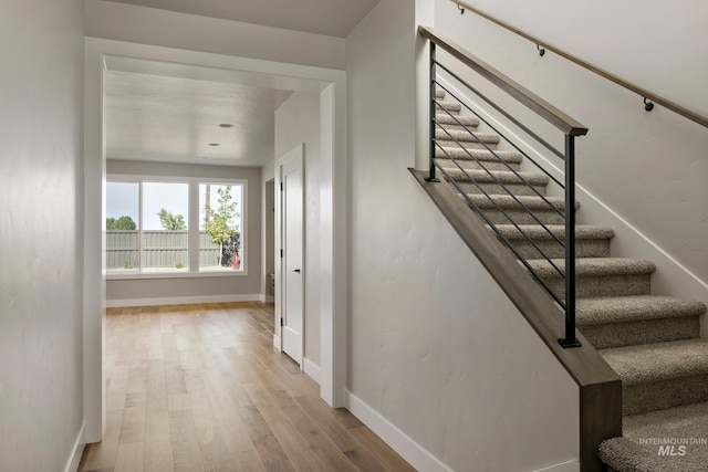 7017 S Zenith Ave, Meridian, ID 83642 - stairway with wood finished floors and baseboards
