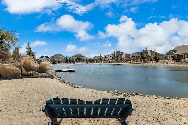 view of water feature with a residential view and a boat dock