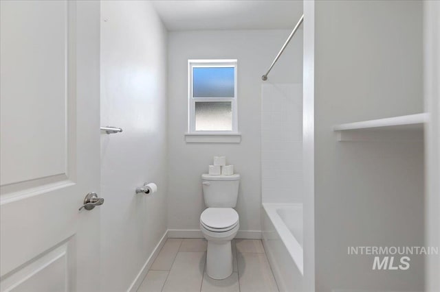 bathroom featuring tile patterned flooring, shower / bath combination, and toilet