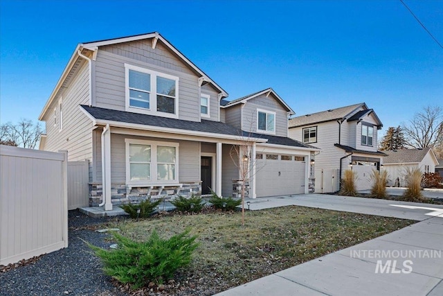 view of front of house with a garage and covered porch