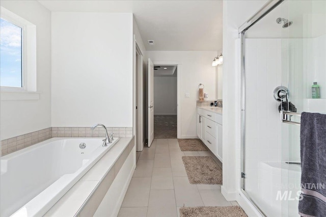 bathroom featuring vanity, tile patterned floors, and independent shower and bath