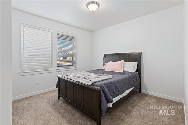 bedroom featuring light colored carpet