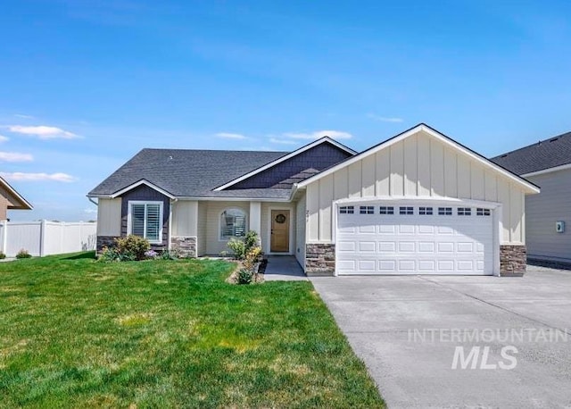 741 Gregory Way, Twin Falls, ID 83301 - view of front of property featuring stone siding, board and batten siding, an attached garage, concrete driveway, and a shingled roof