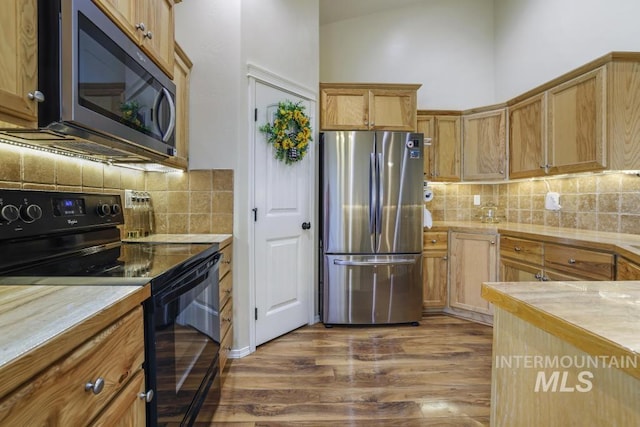 741 Gregory Way, Twin Falls, ID 83301 - kitchen with stainless steel appliances, dark wood-style flooring, backsplash, and light countertops