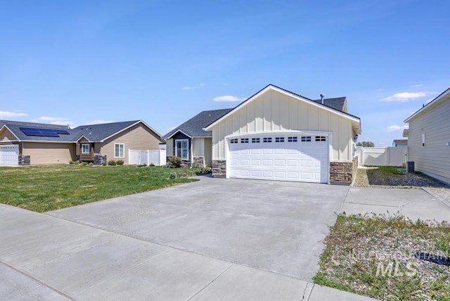 741 Gregory Way, Twin Falls, ID 83301 - single story home featuring board and batten siding, driveway, stone siding, and a garage