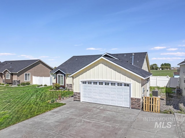 741 Gregory Way, Twin Falls, ID 83301 - single story home featuring board and batten siding, stone siding, concrete driveway, an attached garage, and a gate