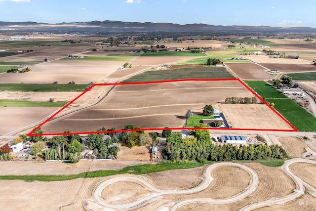 aerial view featuring a rural view and a mountain view