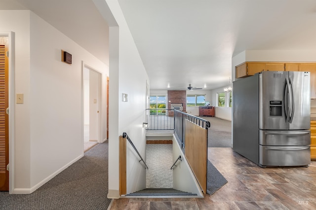 18822 Chicken Dinner Rd, Caldwell, ID 83607 - kitchen with ceiling fan, dark carpet, and stainless steel fridge with ice dispenser