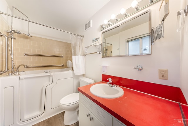 18822 Chicken Dinner Rd, Caldwell, ID 83607 - full bathroom with vanity, toilet, separate shower and tub, and hardwood / wood-style floors