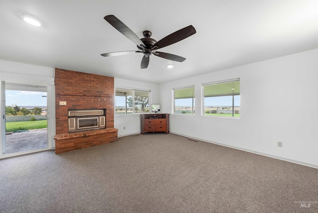 18822 Chicken Dinner Rd, Caldwell, ID 83607 - unfurnished living room with ceiling fan, carpet flooring, and a fireplace