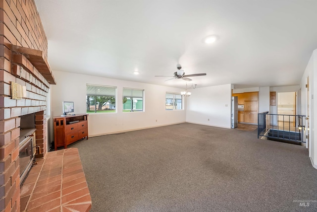 18822 Chicken Dinner Rd, Caldwell, ID 83607 - unfurnished living room featuring ceiling fan, carpet, and a fireplace