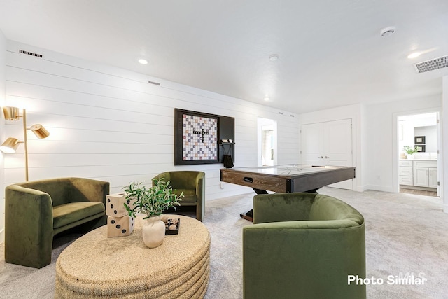 living room featuring carpet floors, recessed lighting, and visible vents