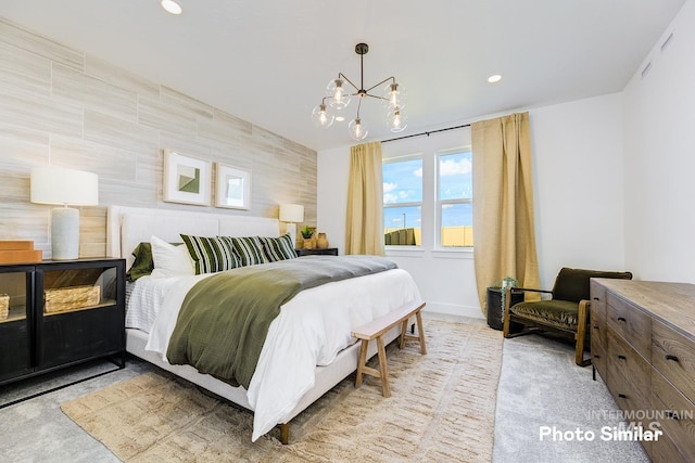 bedroom featuring an inviting chandelier and recessed lighting