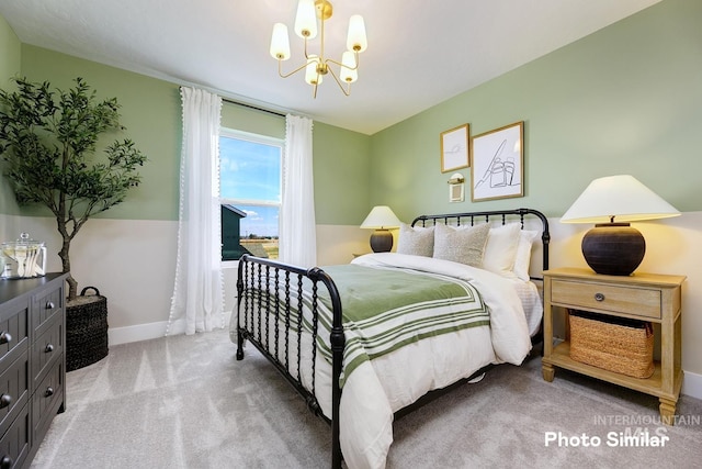 bedroom with carpet floors, baseboards, and an inviting chandelier
