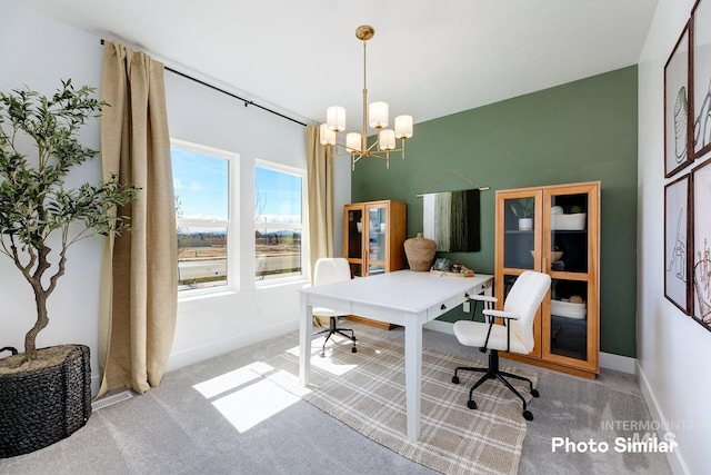office featuring carpet floors, baseboards, and a chandelier