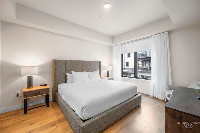 bedroom with light hardwood / wood-style flooring