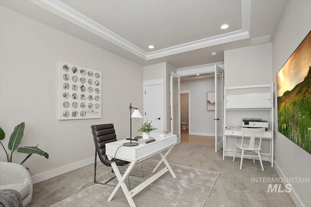 carpeted office featuring a tray ceiling, recessed lighting, and baseboards