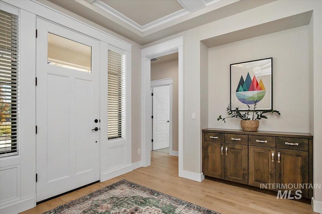 entrance foyer featuring baseboards and light wood finished floors