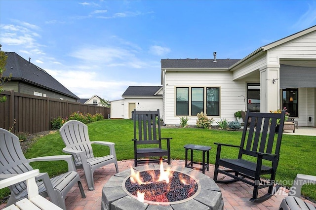 view of patio / terrace with fence and a fire pit