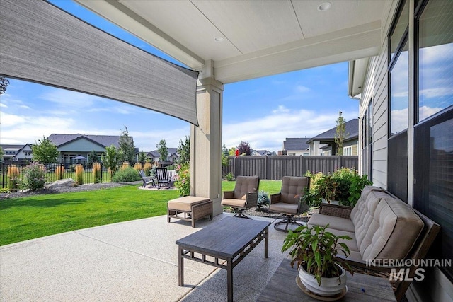 view of patio / terrace with a residential view, a fenced backyard, and an outdoor living space