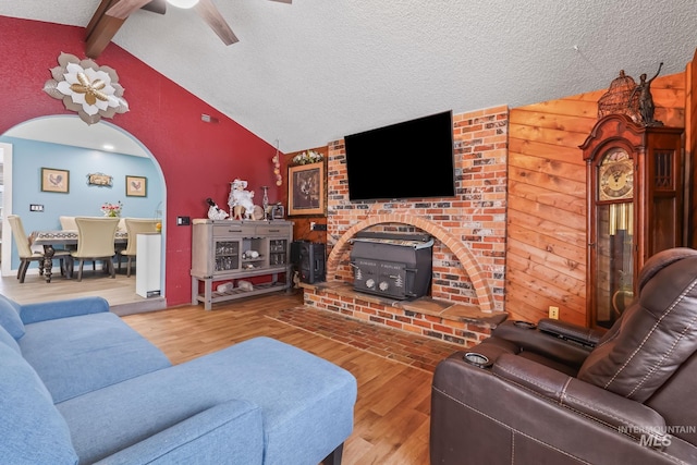 15201 Christopher, Caldwell, ID 83607 - living room with a wood stove, wood finished floors, ceiling fan, and a textured ceiling