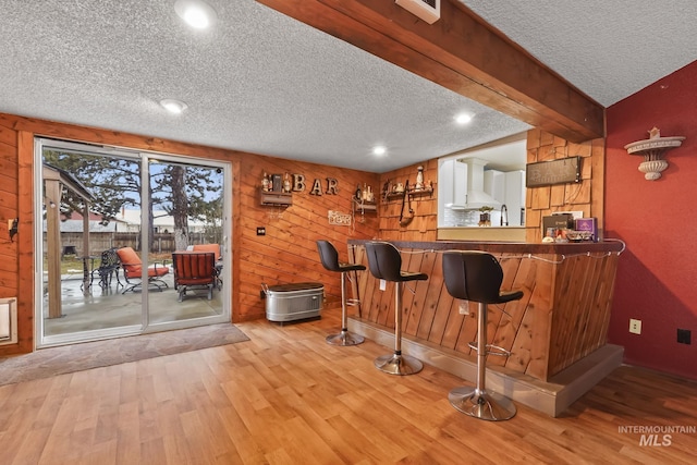 15201 Christopher, Caldwell, ID 83607 - indoor bar featuring a textured ceiling, wood finished floors, recessed lighting, wall chimney exhaust hood, and wooden walls