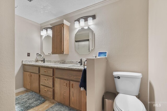 15201 Christopher, Caldwell, ID 83607 - full bathroom featuring double vanity, toilet, crown molding, and a textured ceiling