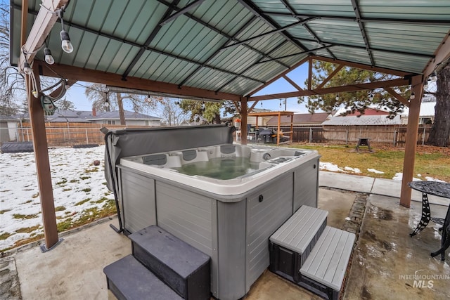 15201 Christopher, Caldwell, ID 83607 - snow covered patio with a hot tub, a fenced backyard, and a patio area