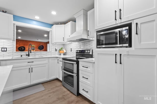 15201 Christopher, Caldwell, ID 83607 - kitchen with stainless steel appliances, a sink, custom exhaust hood, light countertops, and recessed lighting