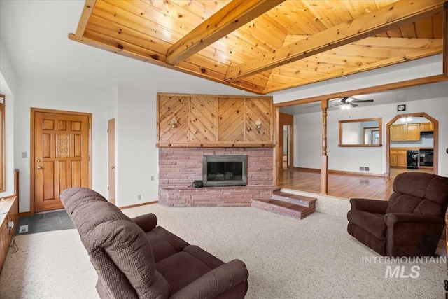 4523 N Mountain View Dr, Boise, ID 83704 - living area with wooden ceiling, a glass covered fireplace, ceiling fan, and carpet floors