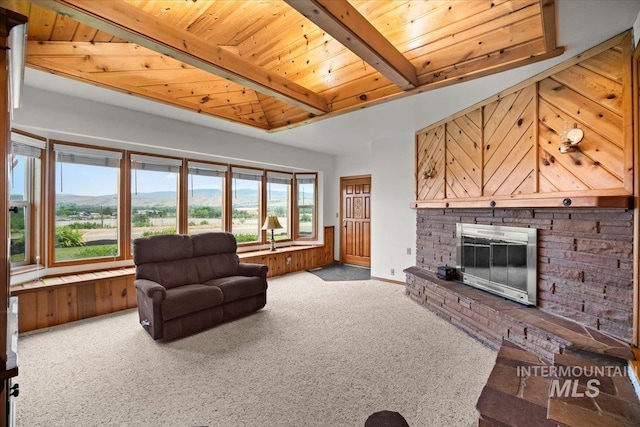 4523 N Mountain View Dr, Boise, ID 83704 - carpeted living room with a wooden ceiling with exposed beams and a fireplace