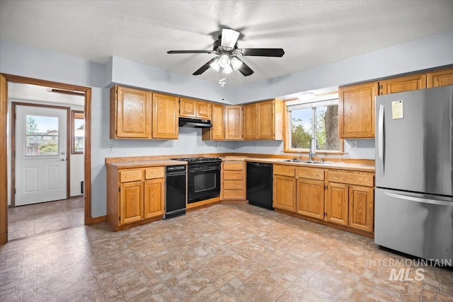 4523 N Mountain View Dr, Boise, ID 83704 - kitchen with black appliances, under cabinet range hood, light countertops, a ceiling fan, and brown cabinets